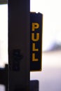 Retro pull sign on a door Royalty Free Stock Photo