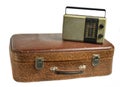 Retro radio receiver on old leather suitcase isolated on white background Royalty Free Stock Photo