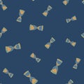 Retro random seamless pattern with orange hourglass elements. Navy blue background. Decorative print