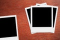 Blank polaroid photos. Vintage frames on the wood. Royalty Free Stock Photo