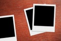 Blank polaroid photos. Vintage frames on the wood. Royalty Free Stock Photo