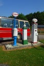 Retro Red Bus Transportation and old fashioned petrol pumps