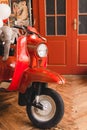 Retro red scooter  in oldschool vintage interior with air balloons. Royalty Free Stock Photo