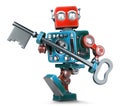 Retro robot holding a big antique key in his hands. . Contains clipping path Royalty Free Stock Photo