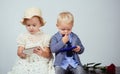 Retro. romantic couple on date. valentines day. happy childhood. using smartphone. small kid with red rose. formal