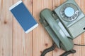 Retro rotary telephone or vintage phone with cable and new cell Royalty Free Stock Photo