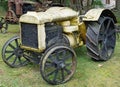 Retro rusty yellow american tractor Fordson brand