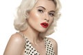 Retro 50s. Old fashioned pin-up model, red lips make-up, blond curly hairstyle