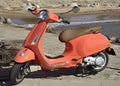 Modern light orange Vespa motorscooter