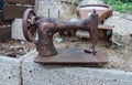 Retro sewing machine and scales on backyard Royalty Free Stock Photo