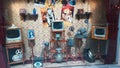 A retro shop window with old Soviet televisions and posters of old movies