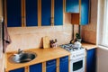 Retro simple kitchen interior design with ugly messy cabinets in need of remodel