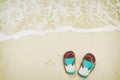 Retro slippers on tropical beach in summer Royalty Free Stock Photo