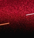 Deep red glitter particles create a shimmering effect across the surface, transitioning to black at the bottom Royalty Free Stock Photo