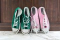 Retro sneakers left on wooden floor Royalty Free Stock Photo