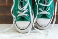 Retro sneakers left on wooden floor Royalty Free Stock Photo