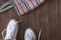 Retro sneakers left on wooden floor Royalty Free Stock Photo