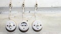 Retro socket and two switchs. A vintage outlet and electrical wiring on white wooden wall. Background for design