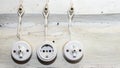 Retro socket and two switchs. A vintage outlet and electrical wiring on white wooden wall. Background for design Royalty Free Stock Photo
