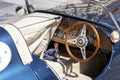 Retro sport car Jaguar. Blue vintage automobile. Steering wheel and dashboard