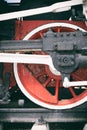 Retro steam locomotive wheels and rods. Details of mechanical parts, wheels and equipment of the train. Royalty Free Stock Photo