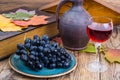 Retro still life with red wine, book, watch and grape