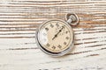 Retro stopwatch on rustic background