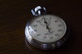 Retro stopwatch is on a wooden table