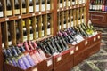 Retro storefronts and boxes with variety red white wine bottles in modern wine boutique