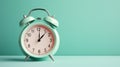 Retro style alarm clock over the mint green background Royalty Free Stock Photo