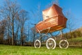 Retro style baby carriage outdoors on sunny day