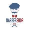 Retro style barber shop emblem representing a man with a mustache, beret and bow tie. Royalty Free Stock Photo