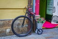 Retro style bicycle and basket with colorful artificial flowers