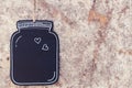 Retro style black wooden tag with hearts on wall. Simple and minimal frame Royalty Free Stock Photo