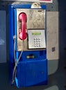 Retro style blue and pink land line public telephone Royalty Free Stock Photo