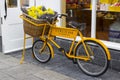 A retro style butcher`s bicycle with advertisements on display outside the L`Occitane shop in Ireland`s up market Kildare Villag