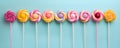 Retro style colorful round shape lollipop on bright background. Round spiral candy on stick Royalty Free Stock Photo