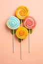 Retro style colorful round shape lollipop on bright background. Round spiral candy on stick Royalty Free Stock Photo