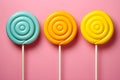 Retro style colorful round shape lollipop on bright background. Round spiral candy on stick Royalty Free Stock Photo