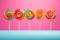 Retro style colorful round shape lollipop on bright background. Round spiral candy on stick Royalty Free Stock Photo