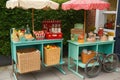 retro-style food stand, with vintage picnic baskets and popcicles