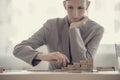 Retro style image of a businesswoman building a ladder of success