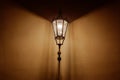 Retro style lantern illuminating wall