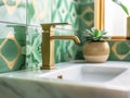 Retro style metal tap and sink in modern bathroom interior with soap bottle and green ceramic tiles wall in the Royalty Free Stock Photo