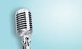 Retro style microphone on blue background