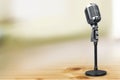 Retro style microphone on blurred background Royalty Free Stock Photo