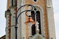 New shiny copper street lamp hood on ornate steel lamp post Royalty Free Stock Photo