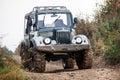 Retro style off-road car on a road Royalty Free Stock Photo