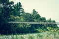 Retro style photo of suspension bridge across Tongariro river Royalty Free Stock Photo