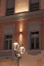 Retro-style street lampposts along a pedestrian street in the city of Acqui Terme, Italy.